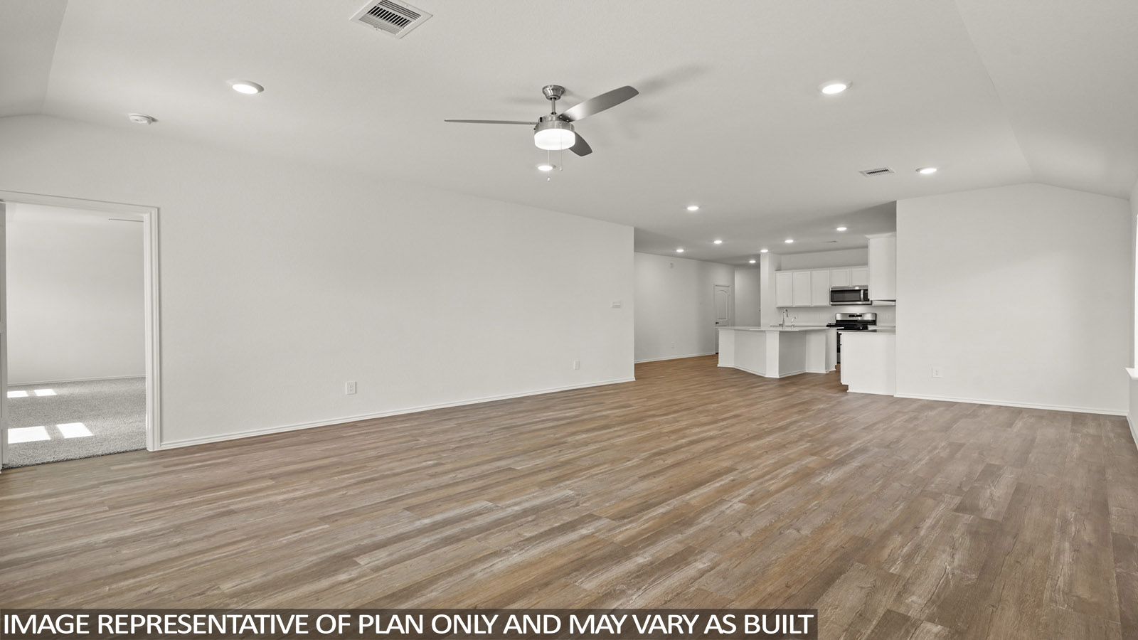 Open living room with windows, white walls, and vinyl wood flooring.