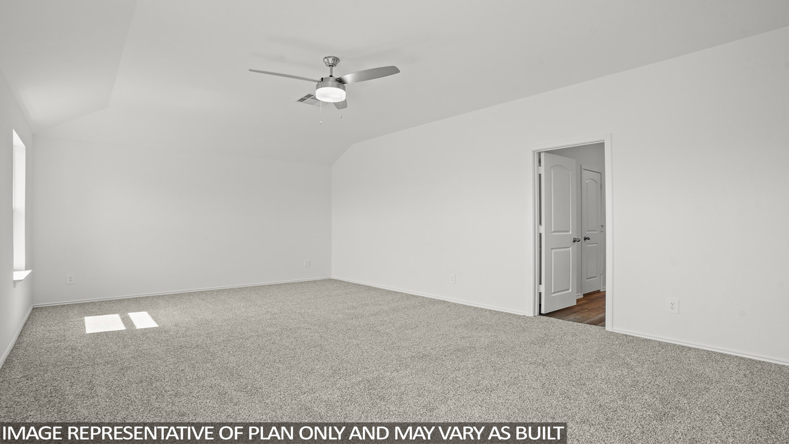 Primary bedroom with windows, white walls, and light carpet.