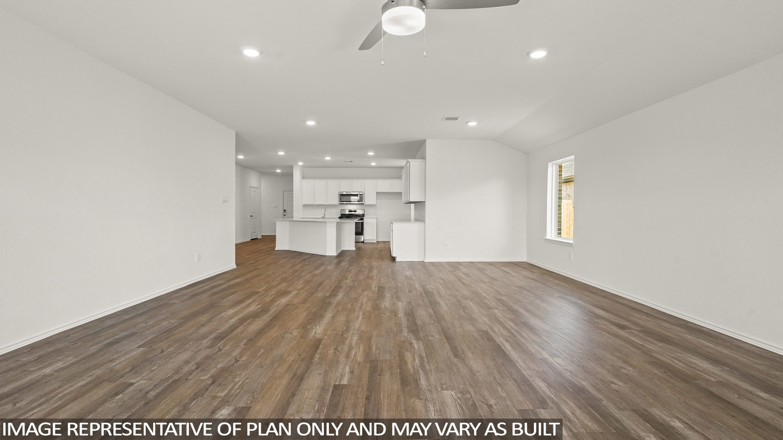 Open living room with windows, white walls, and vinyl wood flooring.