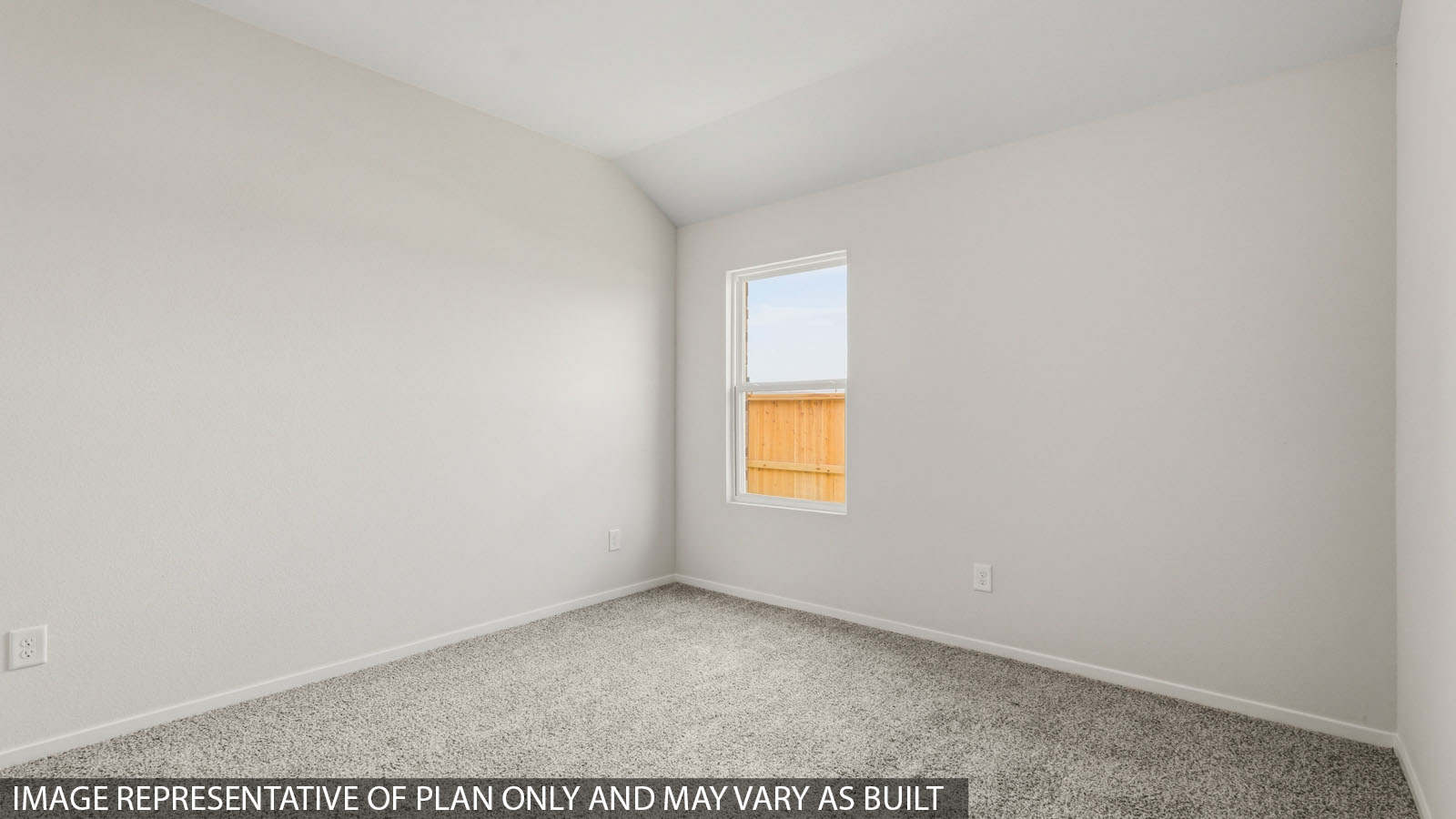 Secondary bedroom with windows, white walls, and light carpet.