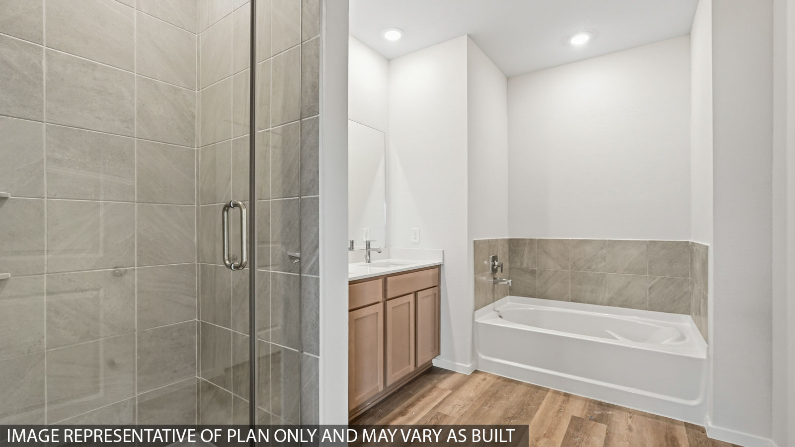 Primary bathroom with dual sinks, shower, tub, white walls, and vinyl wood flooring.