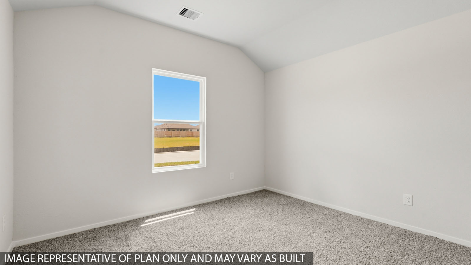 Secondary bedroom with windows, white walls, and light carpet.