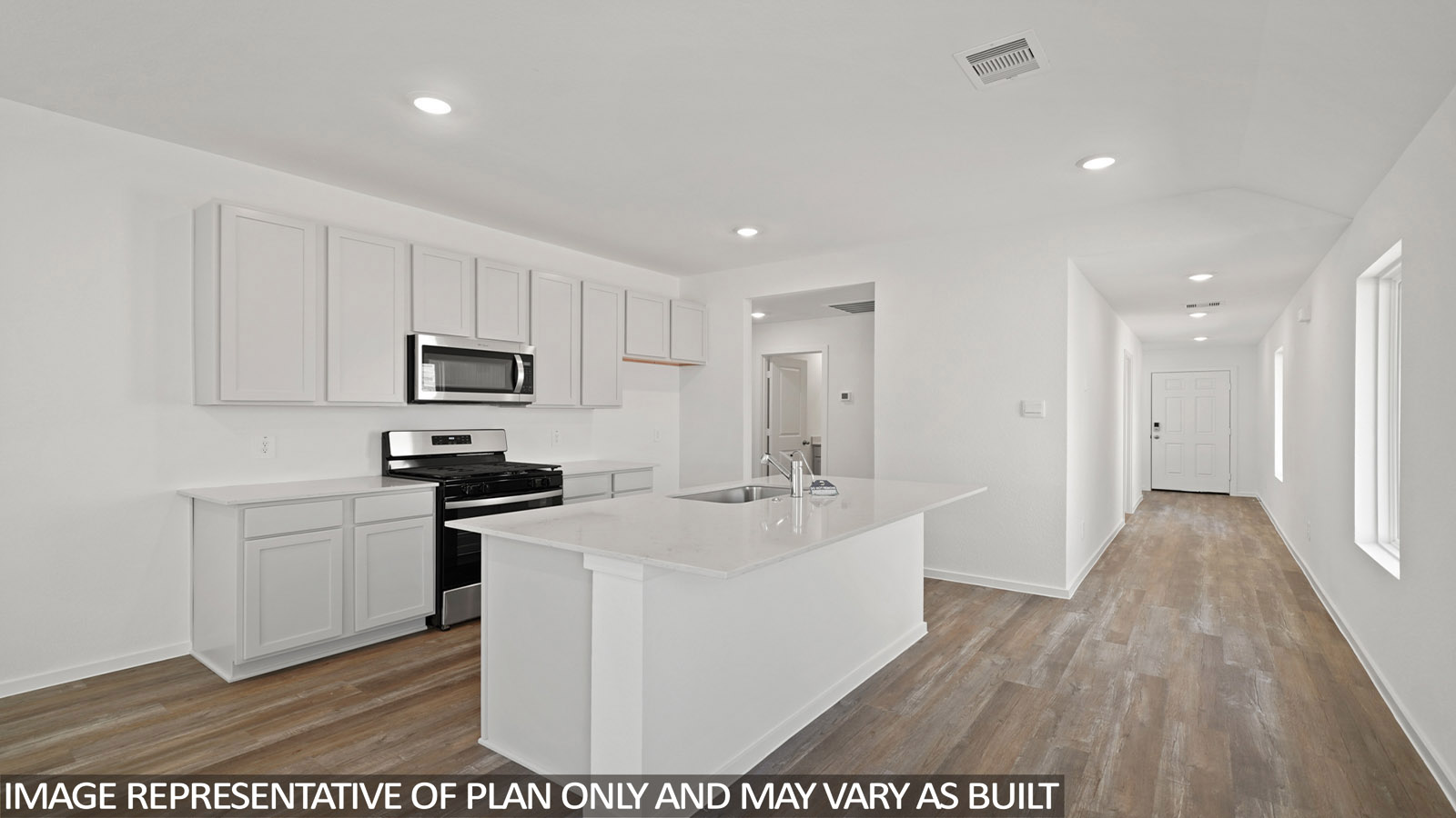 kitchen with stainless steel appliances, quartz countertops, and vinyl flooring