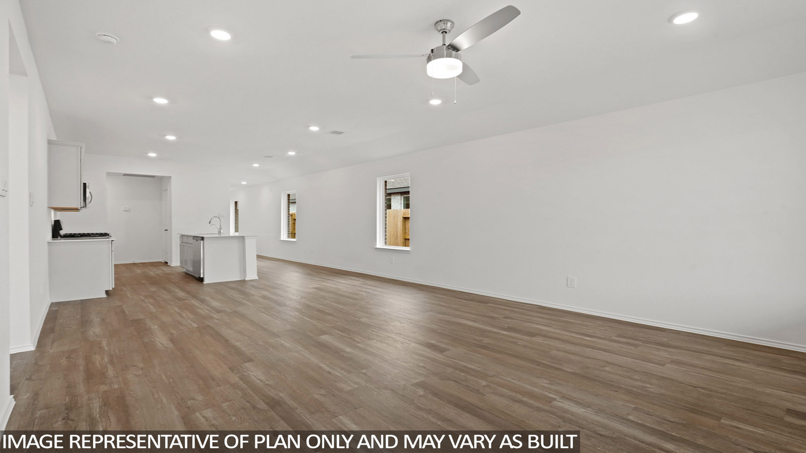 open concept living and dining area with vinyl flooring and large windows