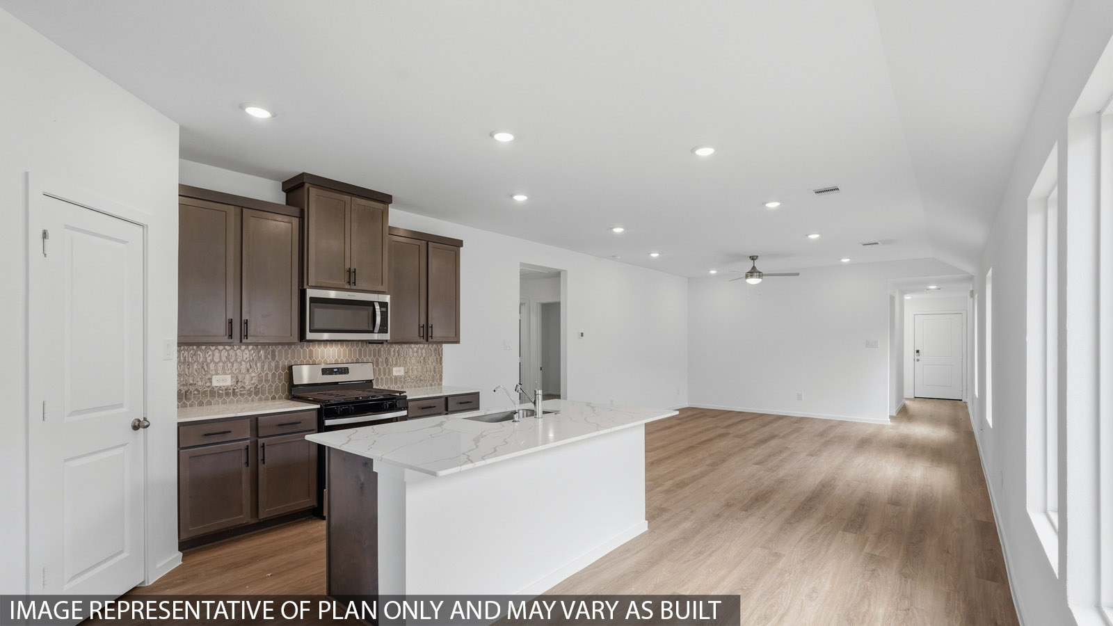 kitchen with quartz countertops and kitchen backsplash