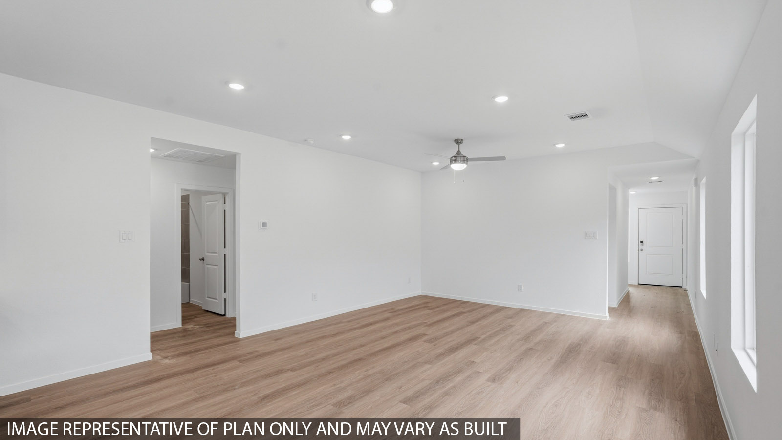 open concept living and dining area with vinyl flooring and large windows