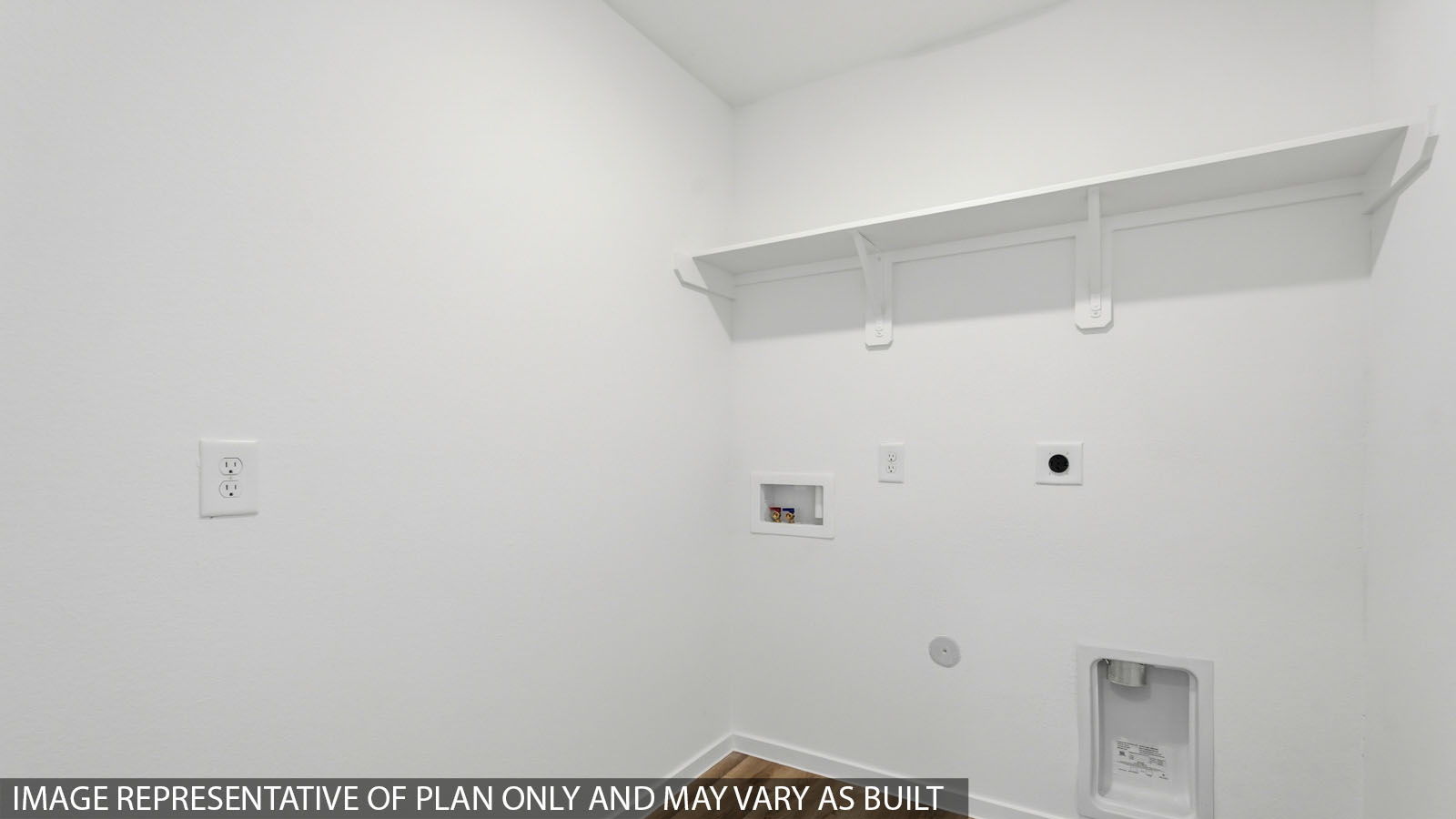 Utility room with storage located off the entry hallway and garage door