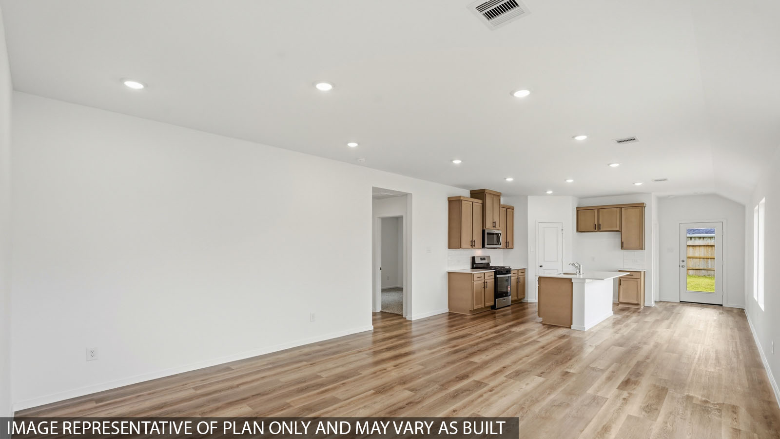 Spacious living area with vinyl flooring and bright windows in Hockley TX