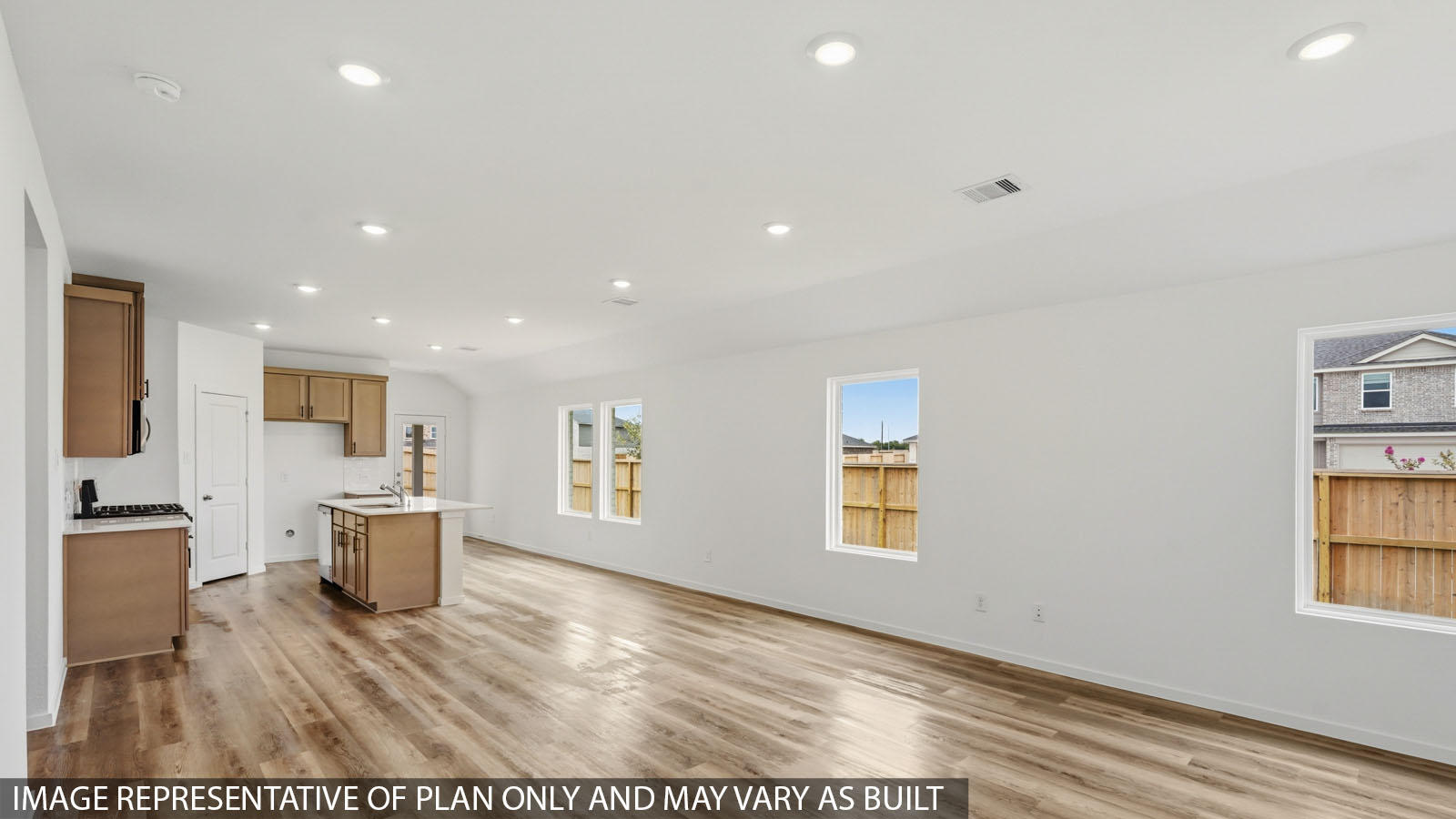 Kitchen with quartz countertops, modern hardware and an island and vinyl floor