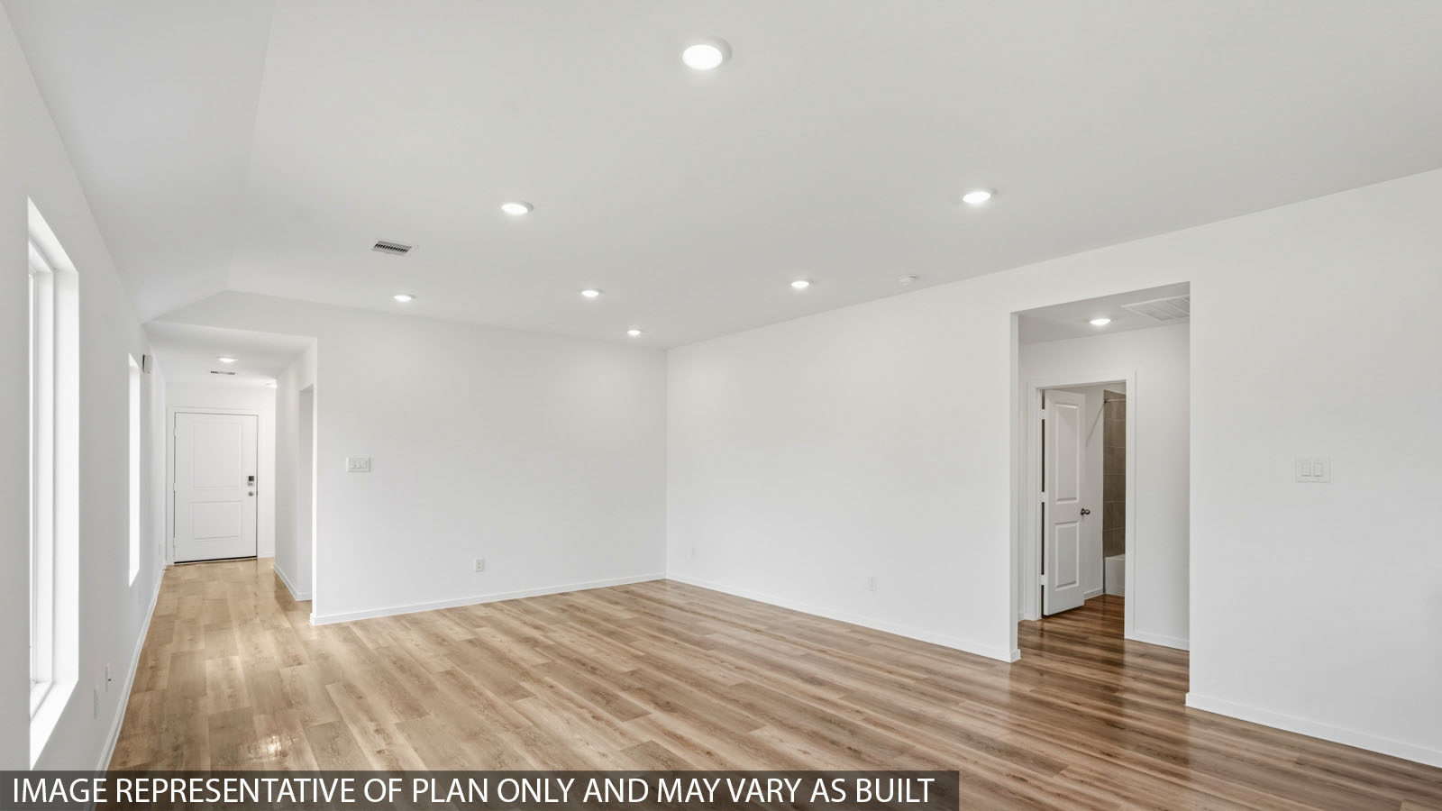 Spacious living area with vinyl flooring and bright windows in Hockley TX