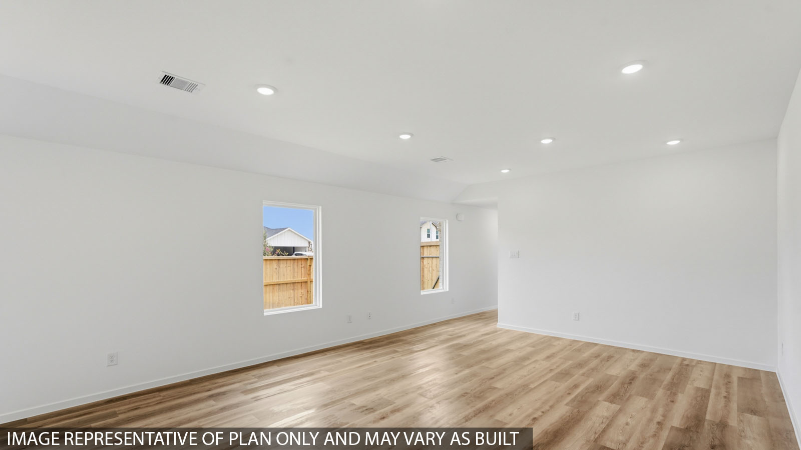 Spacious living area with vinyl flooring and bright windows in Hockley TX