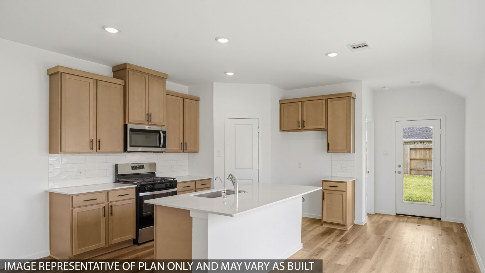 Kitchen with quartz countertops, modern hardware and an island and vinyl floor