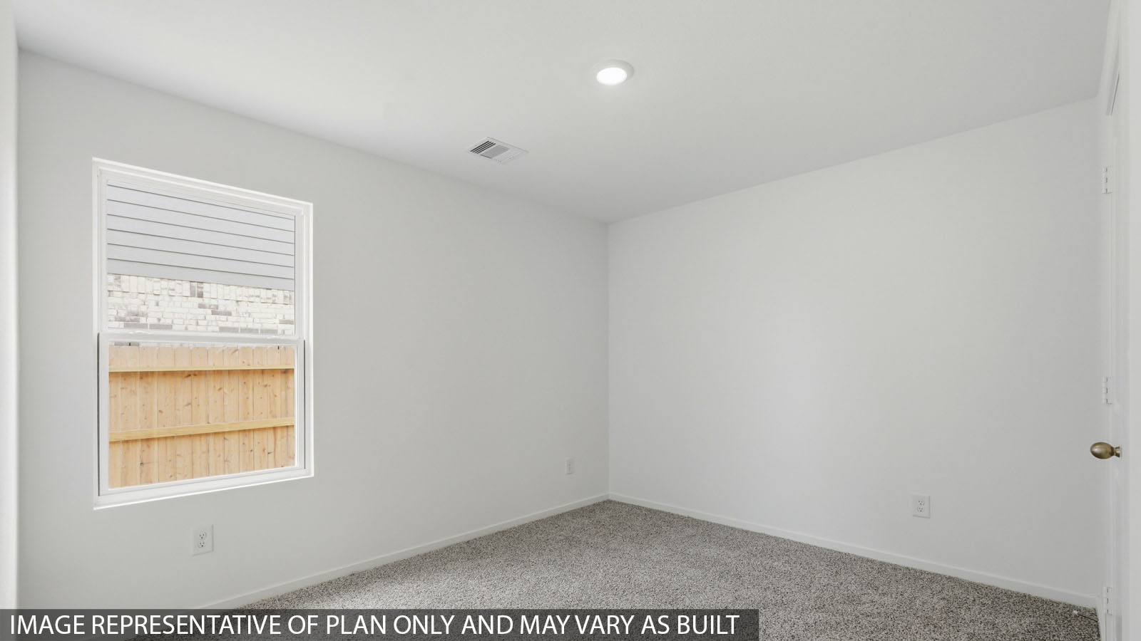 Large Primary bedroom with shag carpet flooring and bright window