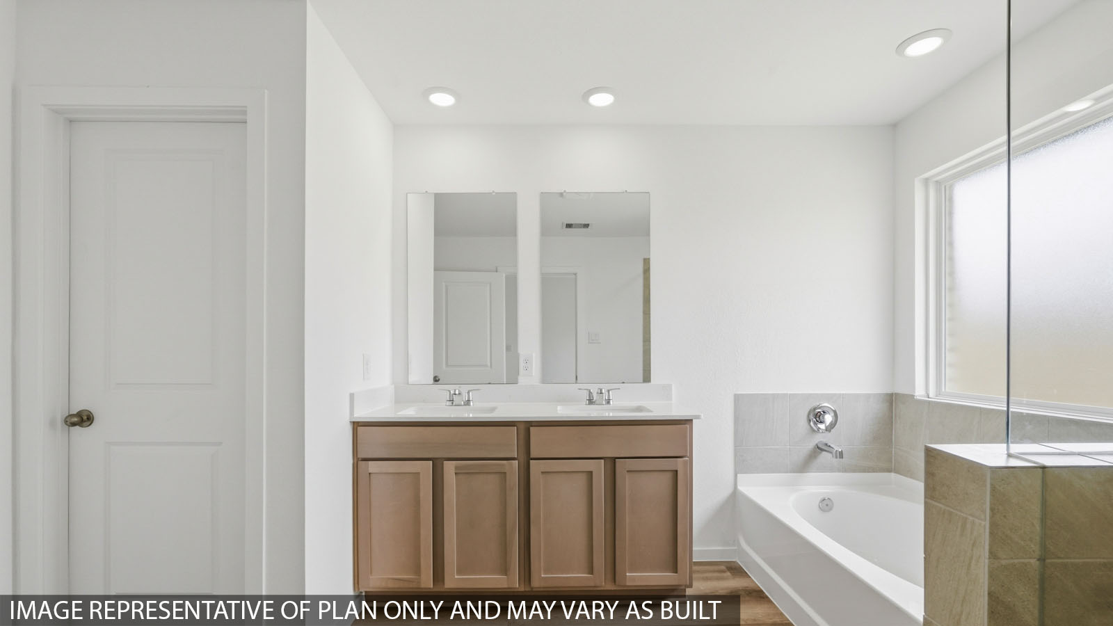 Primary bathroom with double sinks with quartz counter tops in Hockley TX