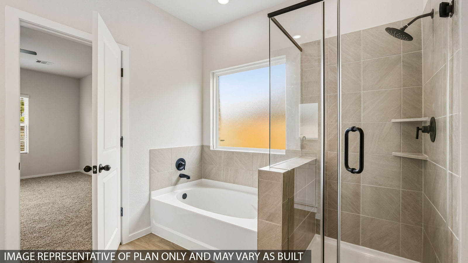 primary bathroom with separate tub and shower