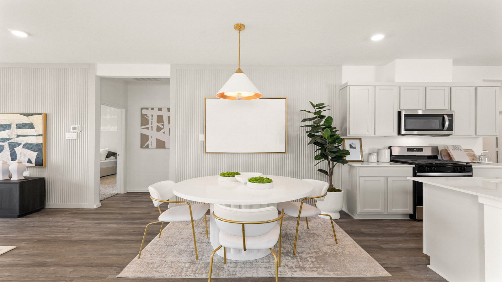 open concept living and dining area with vinyl flooring, quartz countertops, and large windows