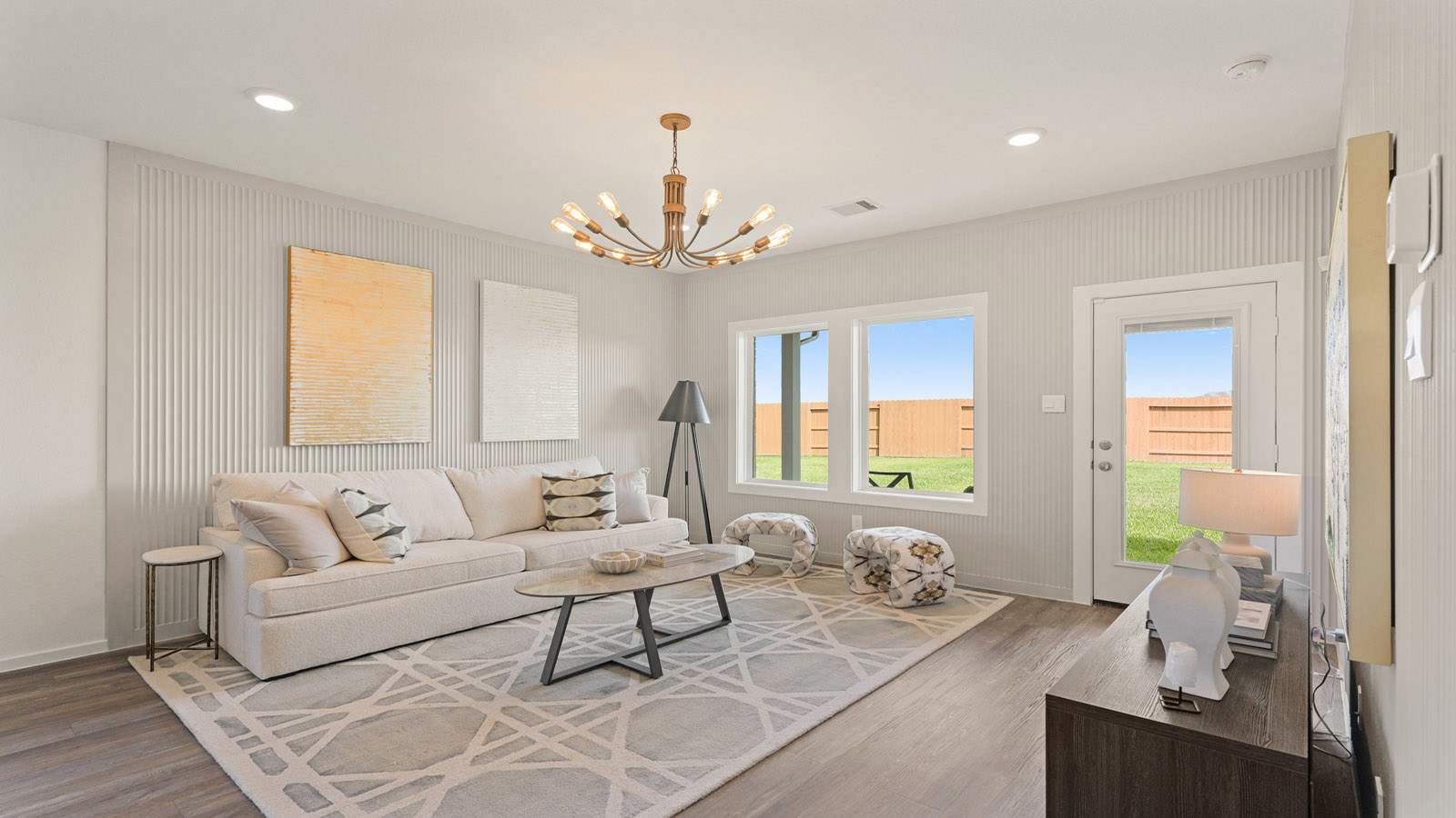 open concept living and dining area with vinyl flooring, quartz countertops, and large windows