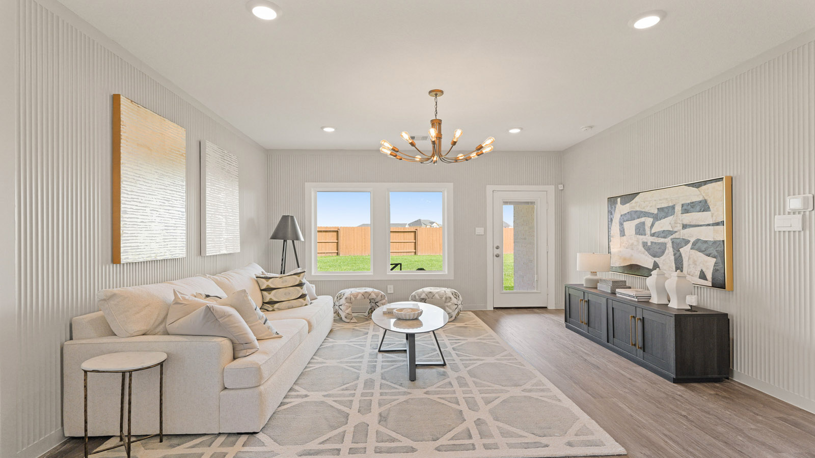 open concept living and dining area with vinyl flooring, quartz countertops, and large windows