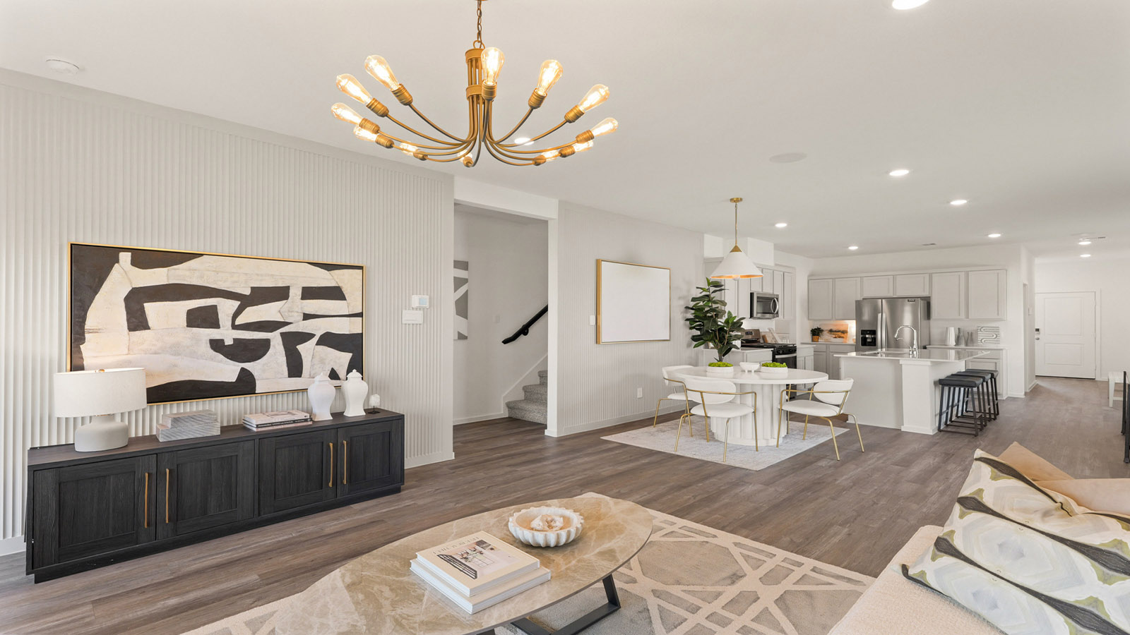 open concept living and dining area with vinyl flooring, quartz countertops, and large windows