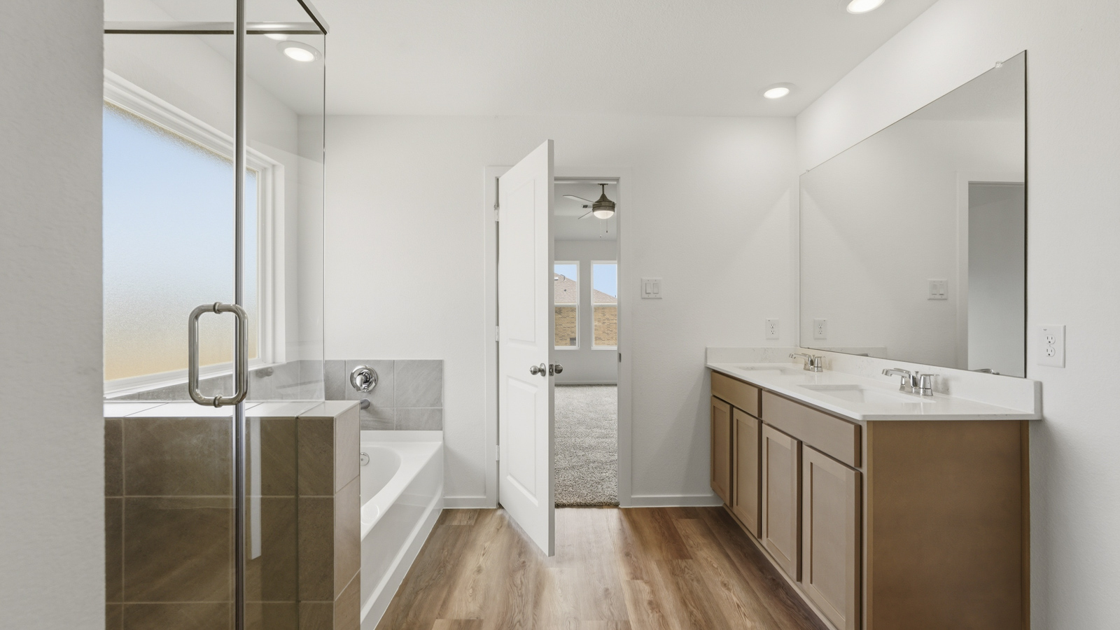 Primary bathroom with separate tub and shower
