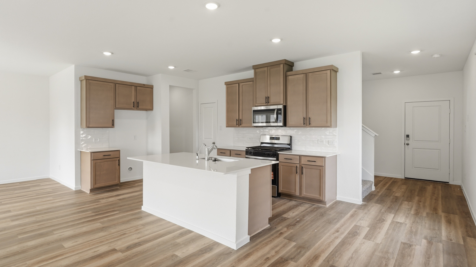 kitchen with stainless steel appliances and quartz countertops in Hockley, Tx