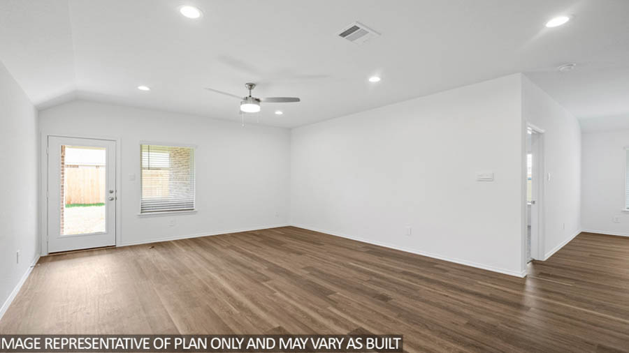 open concept living and dining area with vinyl flooring, quartz countertops, and stainless steel appliances