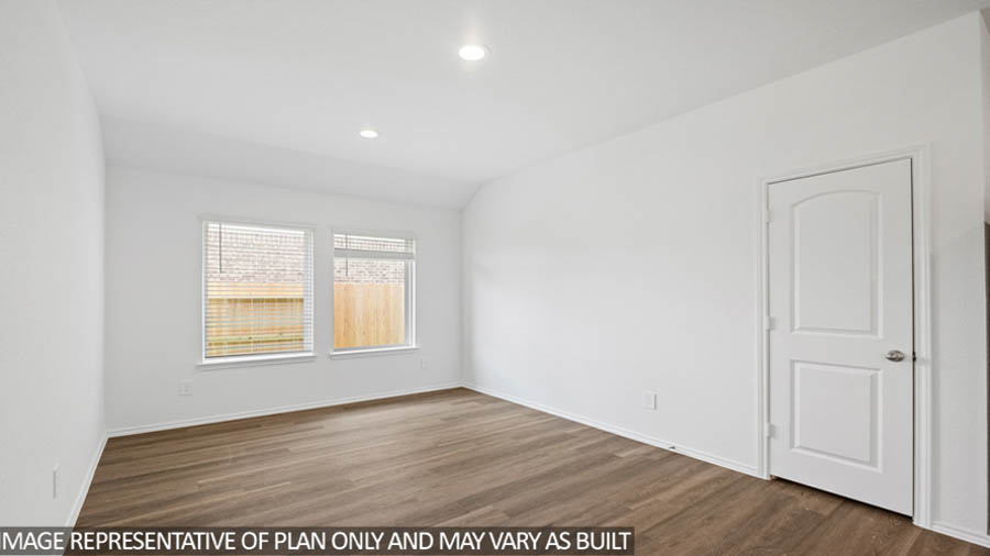 open concept living and dining area with vinyl flooring, quartz countertops, and stainless steel appliances