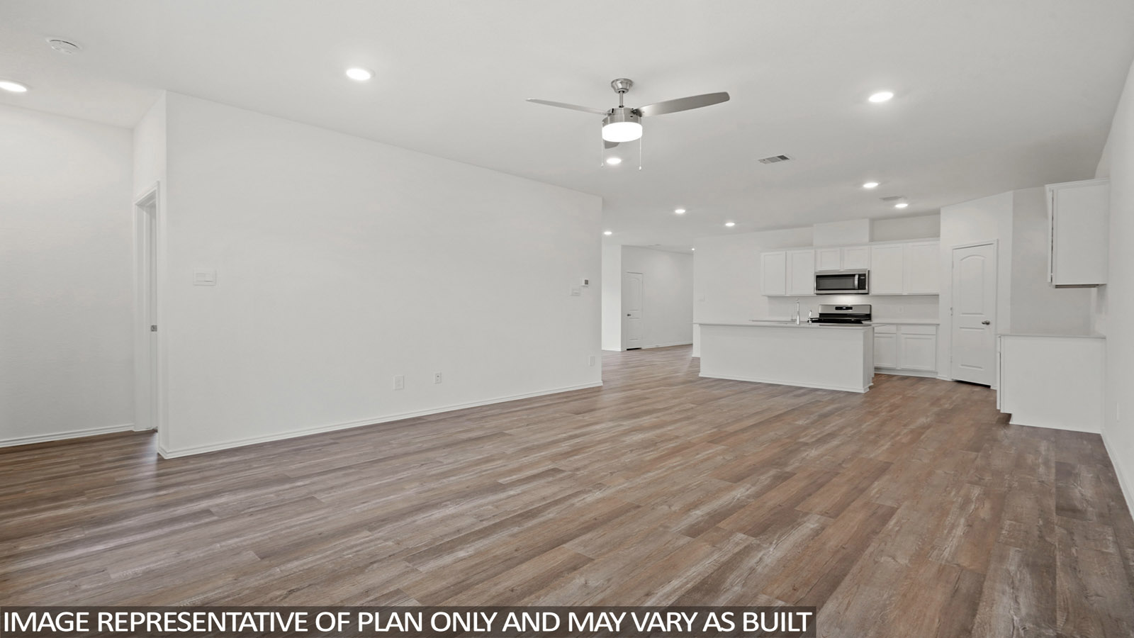 open concept livving and dining area with vinyl flooring, quartz countertops, and large windows