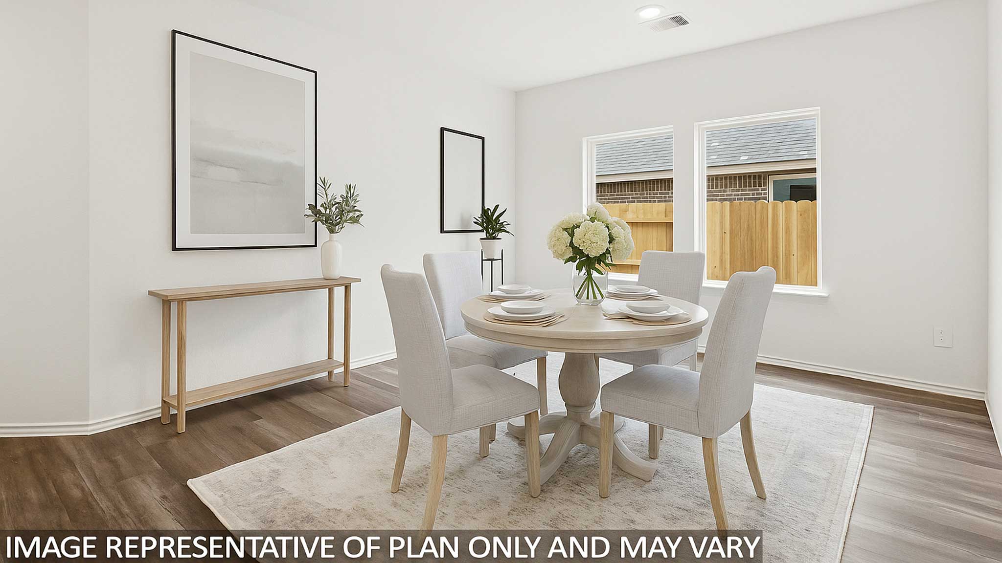 open concept living and dining area with vinyl flooring, quartz countertops, and large windows in Hockley, Tx