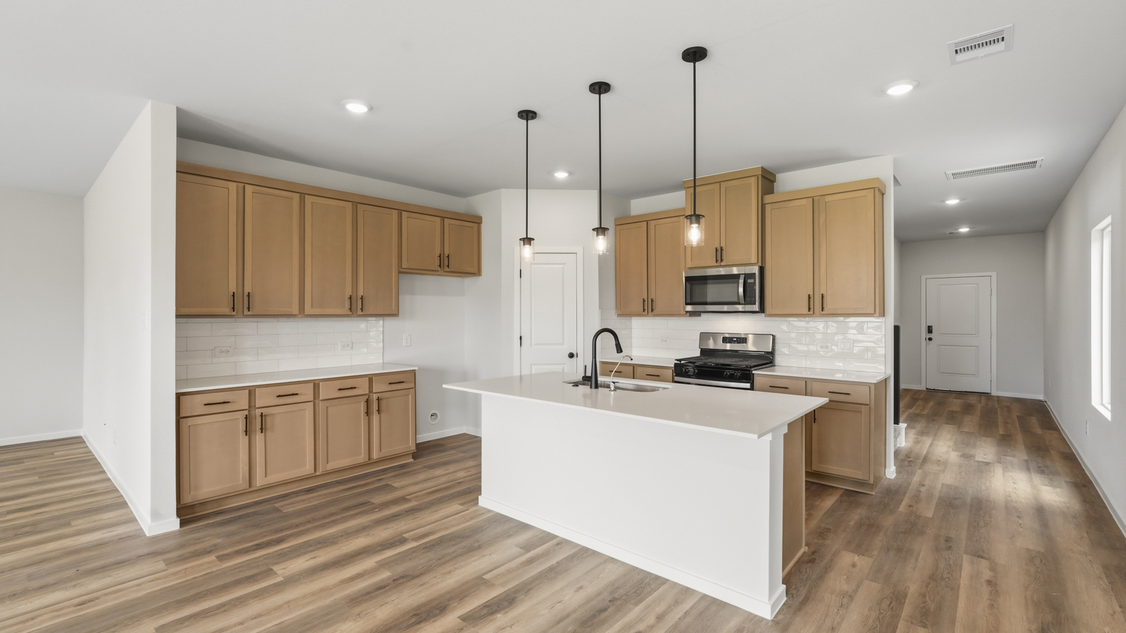 kitchen with quartz contertops and stainless steel appliances