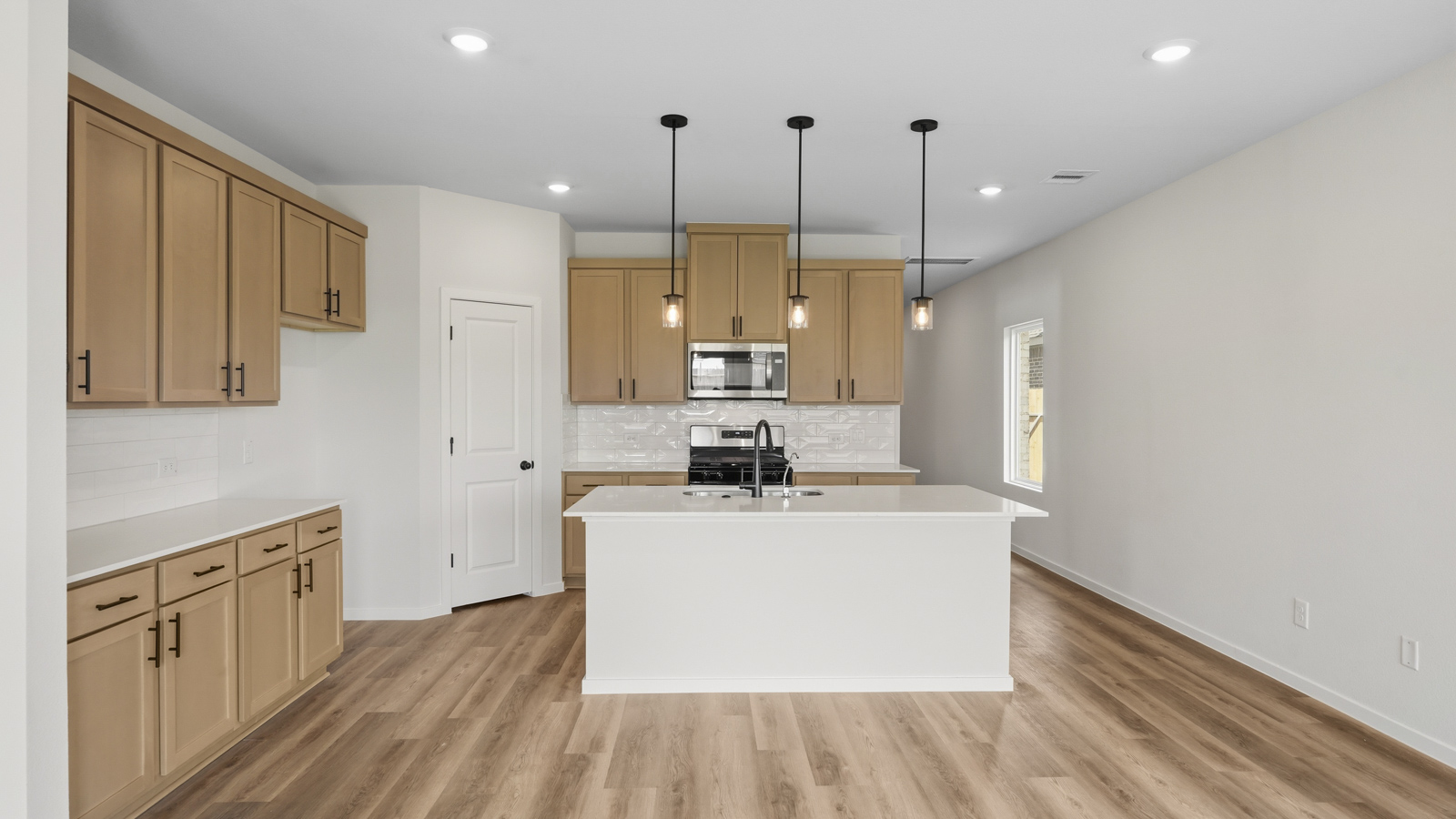 kitchen with quartz contertops and stainless steel appliances
