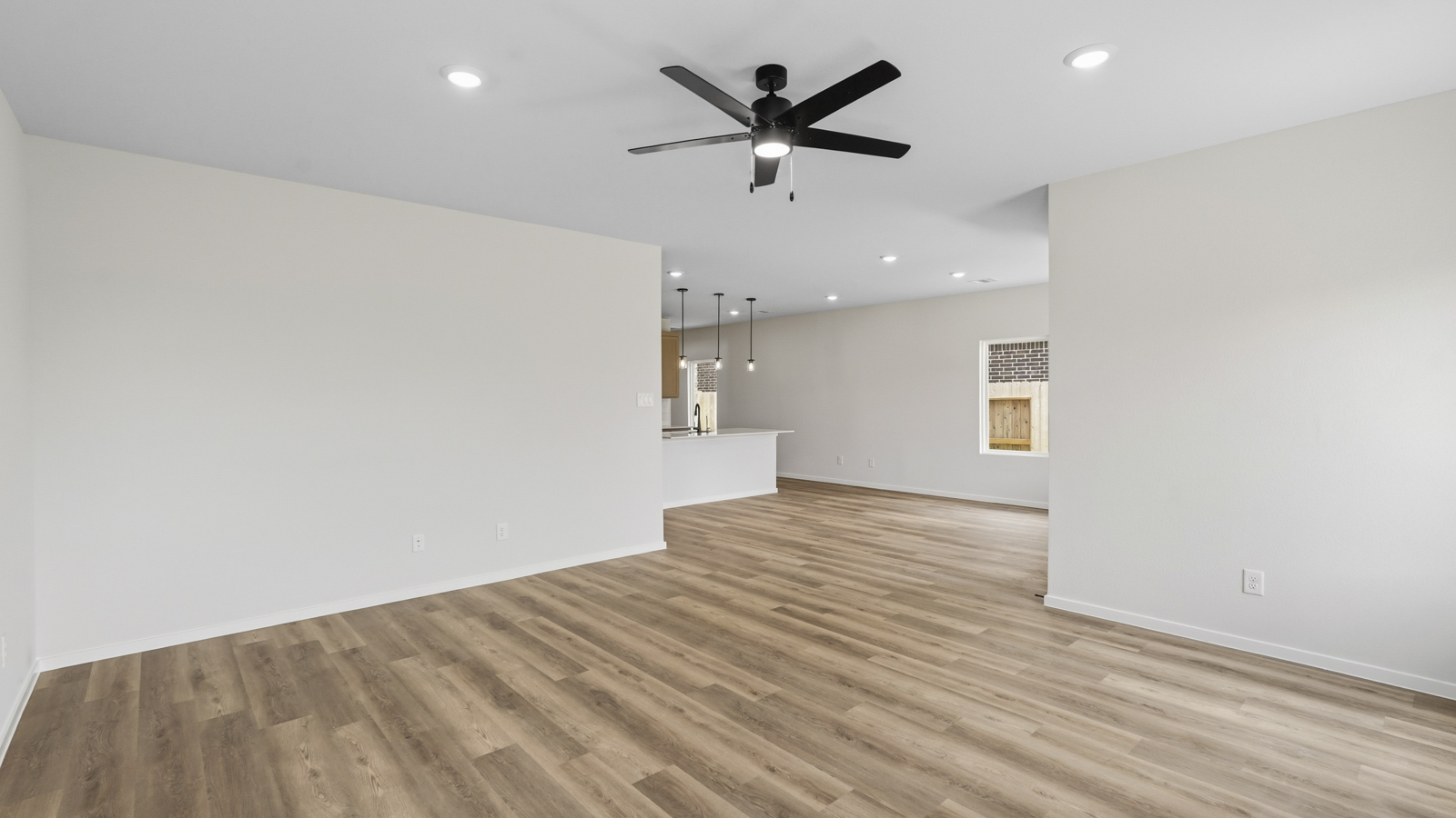 open concept living area with vinyl flooring