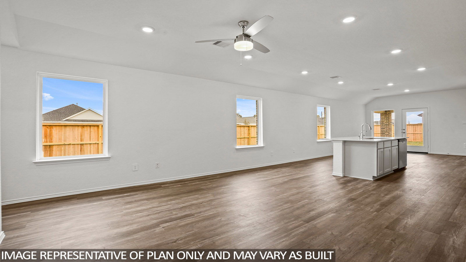 open concept living and dining area with vinyl flooring, quartz countertops, and large windows