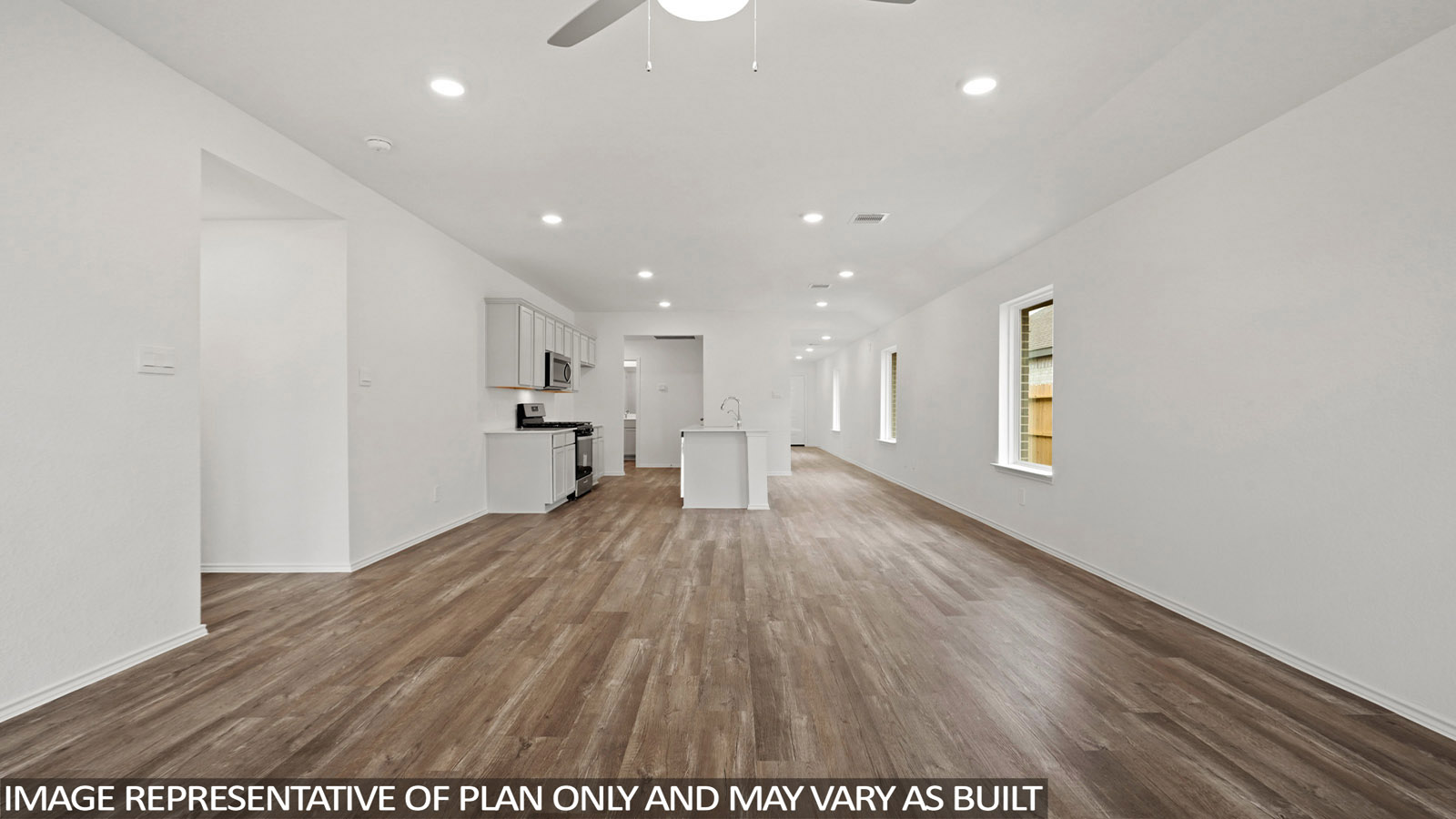 open concept living and dining area with vinyl flooring, quartz countertops, and large windows