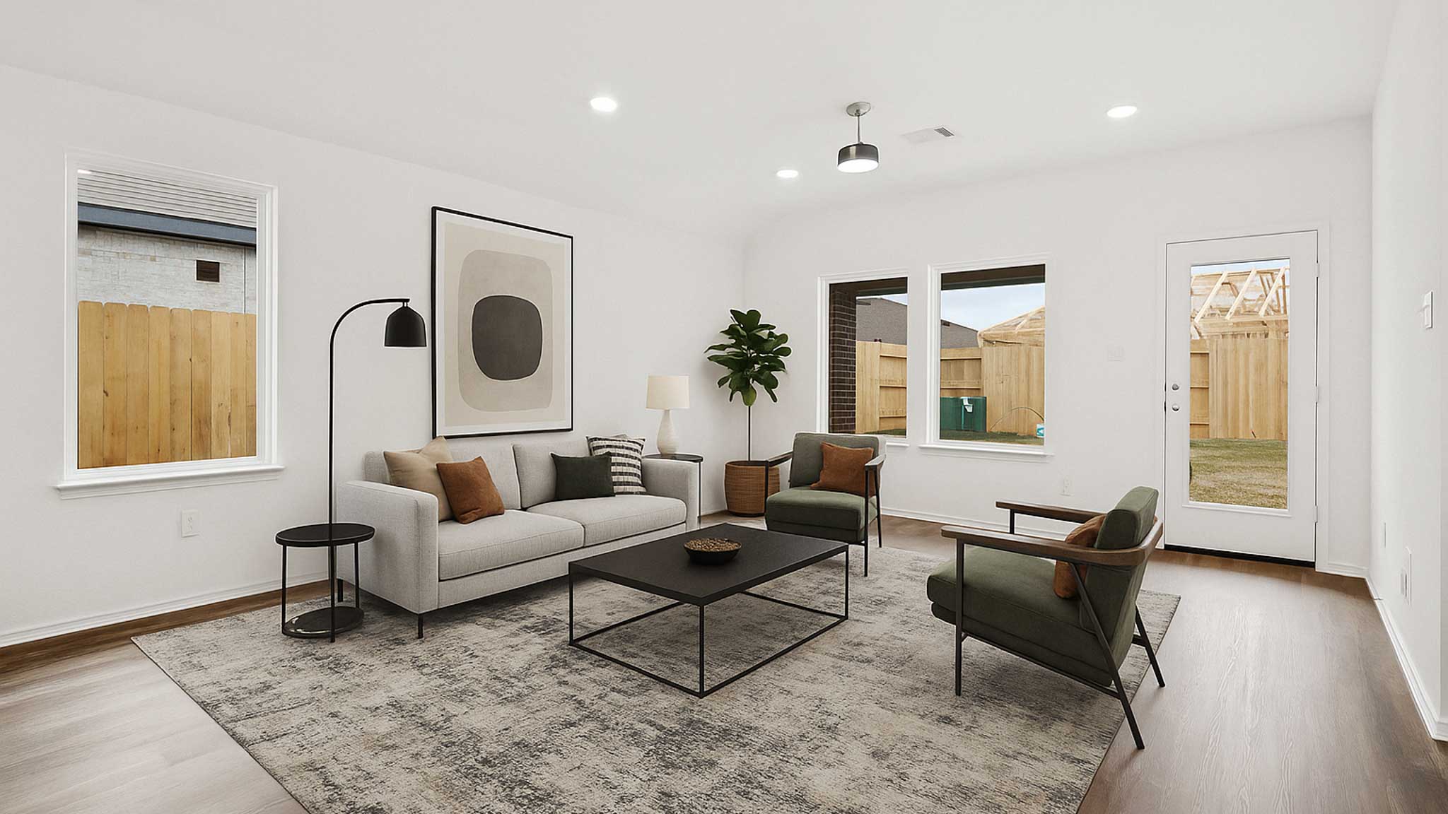 open concept living and dining area with vinyl flooring, quartz countertops, and large windows