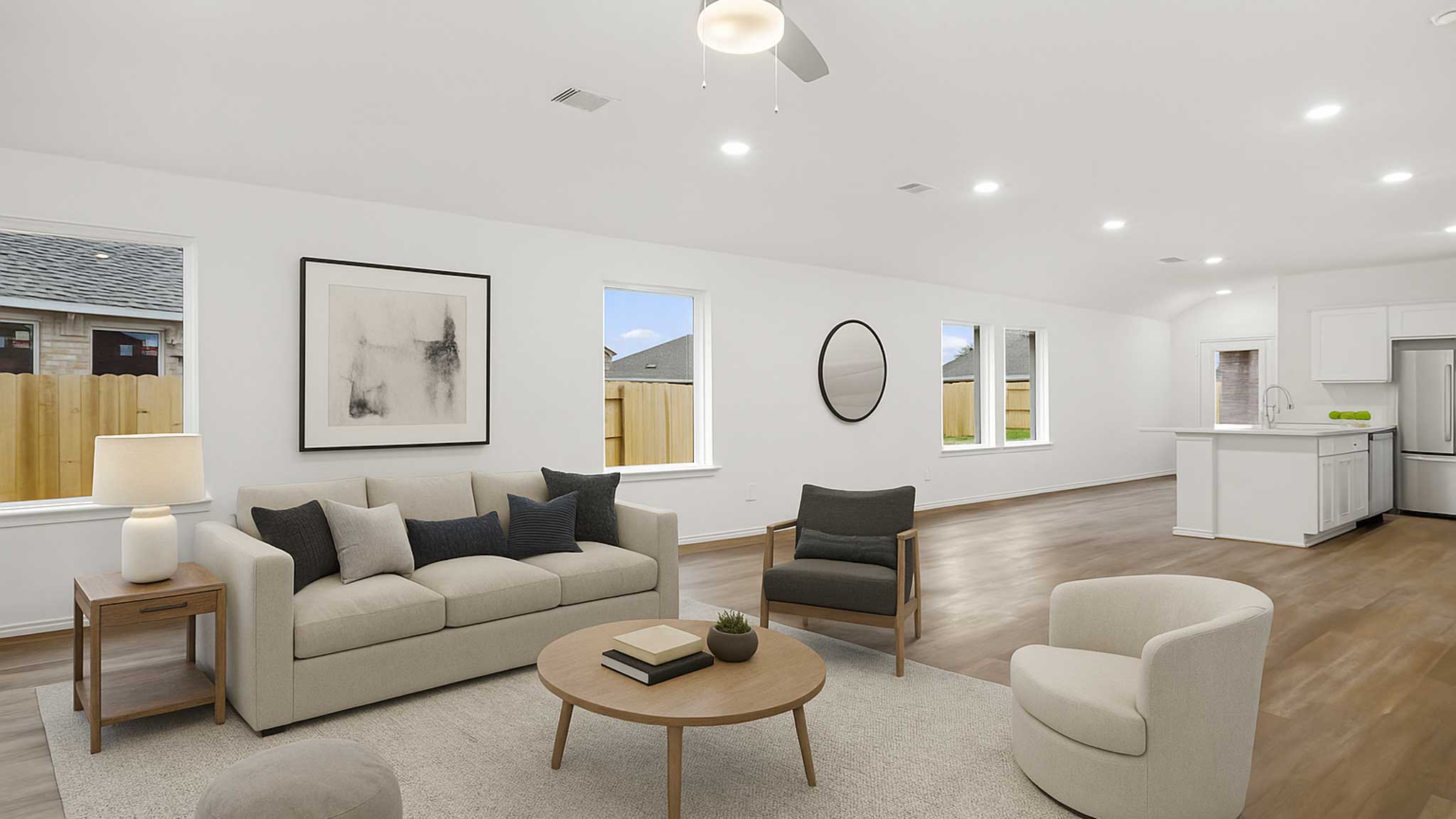 open concept living and dining area with vinyl flooring, quartz countertops, and large windows