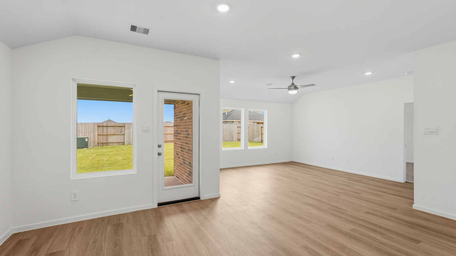 kitchen with pendent lighting, backsplash, and quartz countertops in Hockley, TX