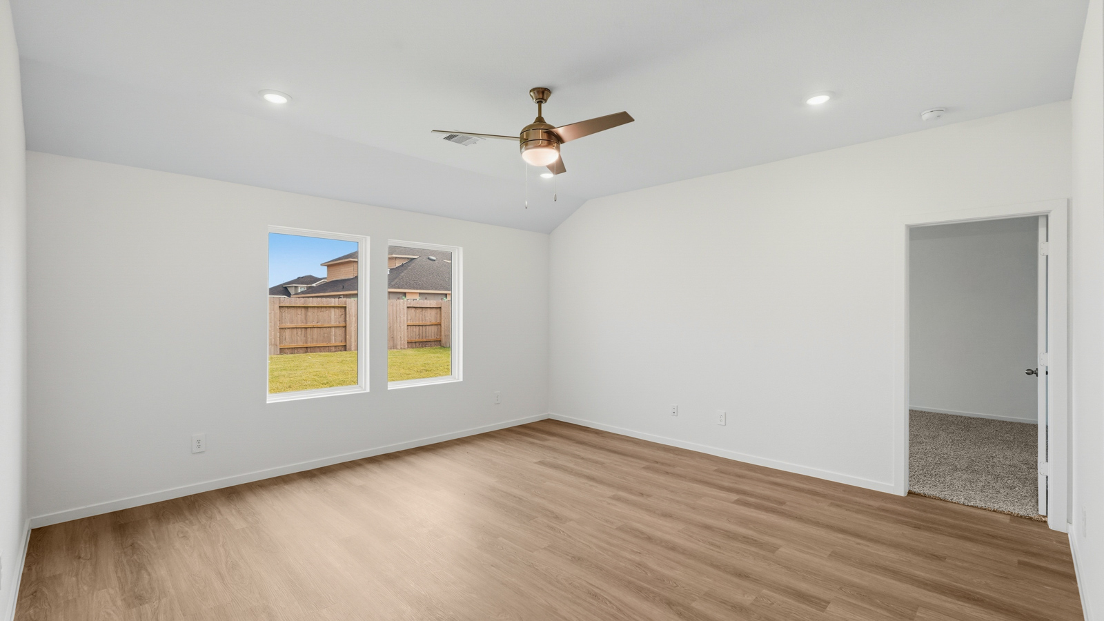 kitchen with pendent lighting, backsplash, and quartz countertops in Hockley, TX
