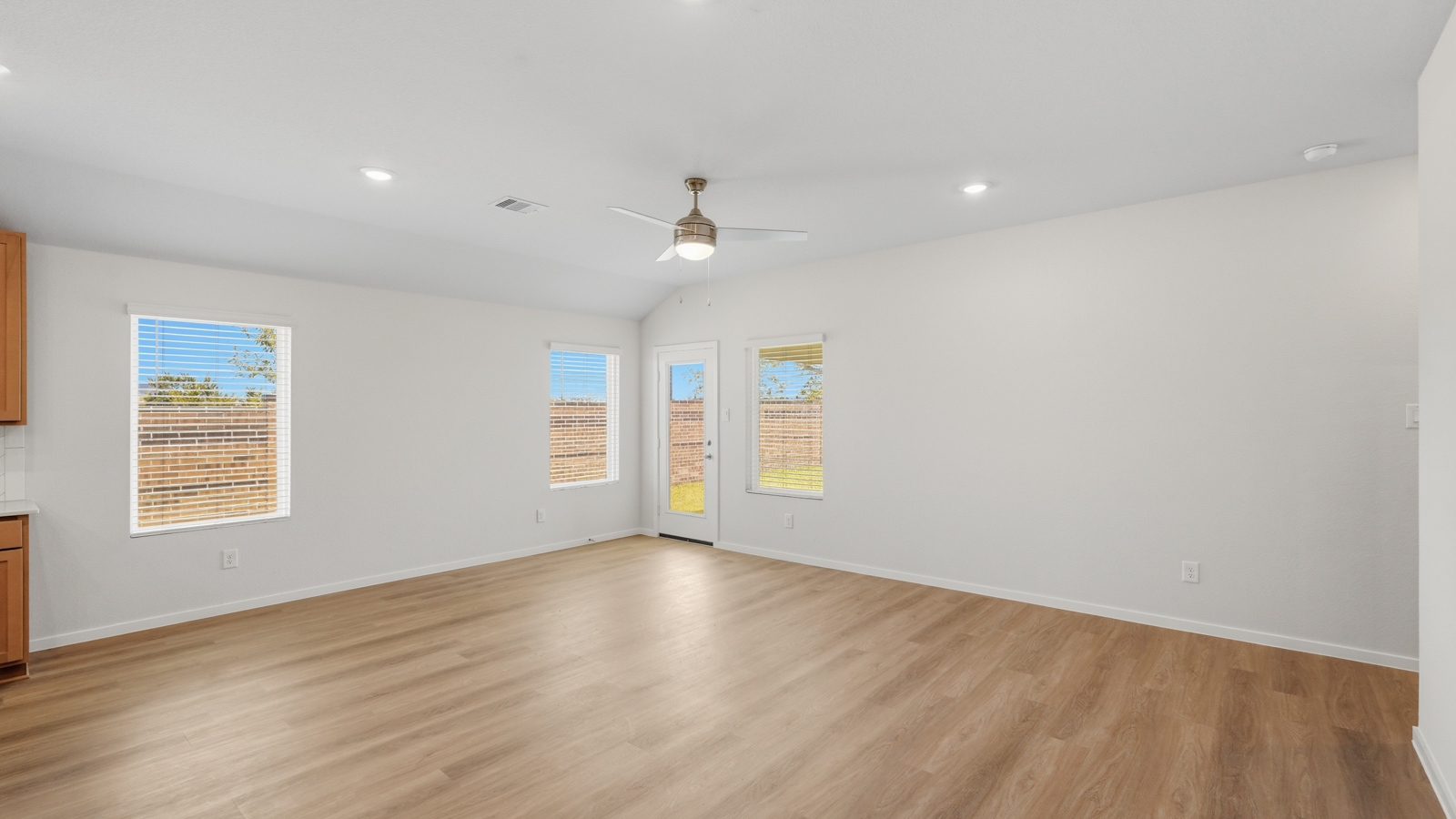 open concept living and dining area with vinyl flooring