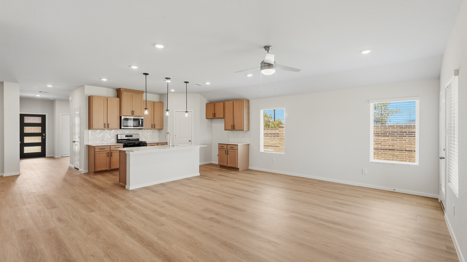 open concept living and dining area with vinyl flooring