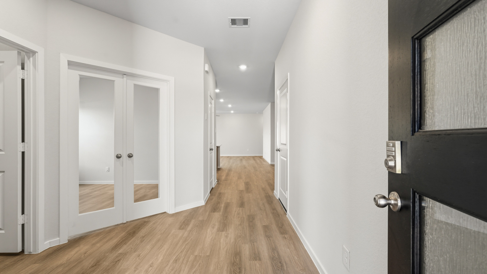 open concept living and dining area with vinyl flooring