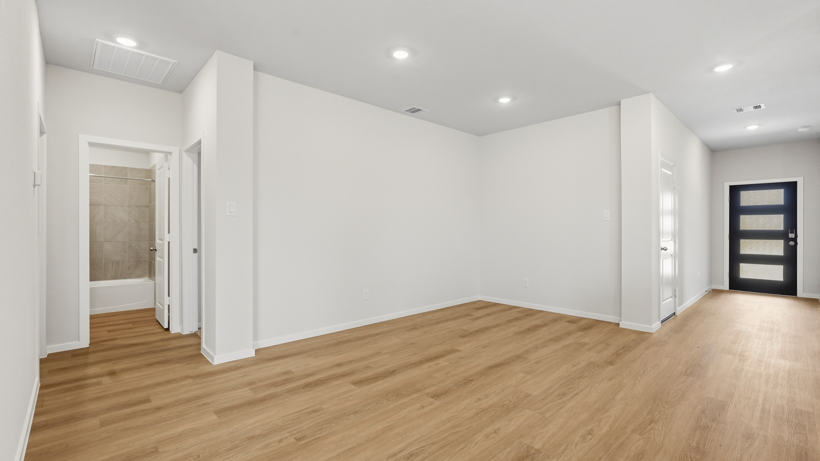 open concept living and dining area with vinyl flooring