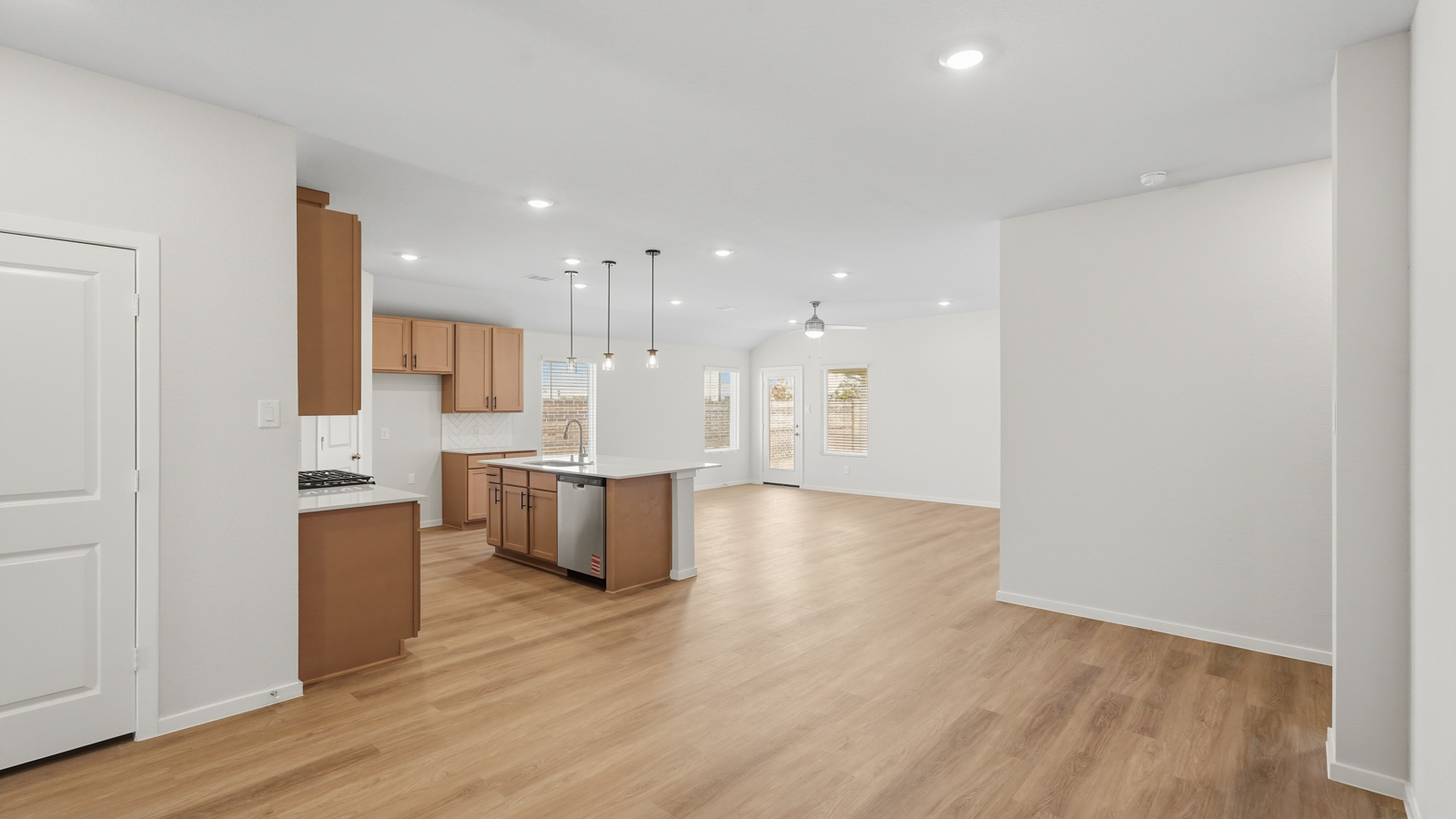 open concept living and dining area with vinyl flooring