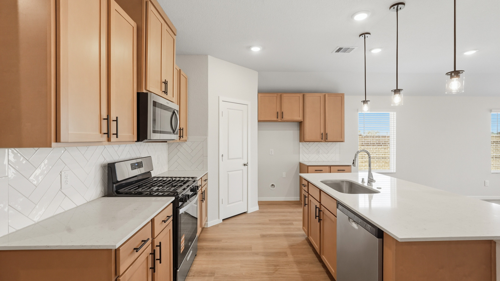 kitchen with quartz countertops and stainless steel appliances