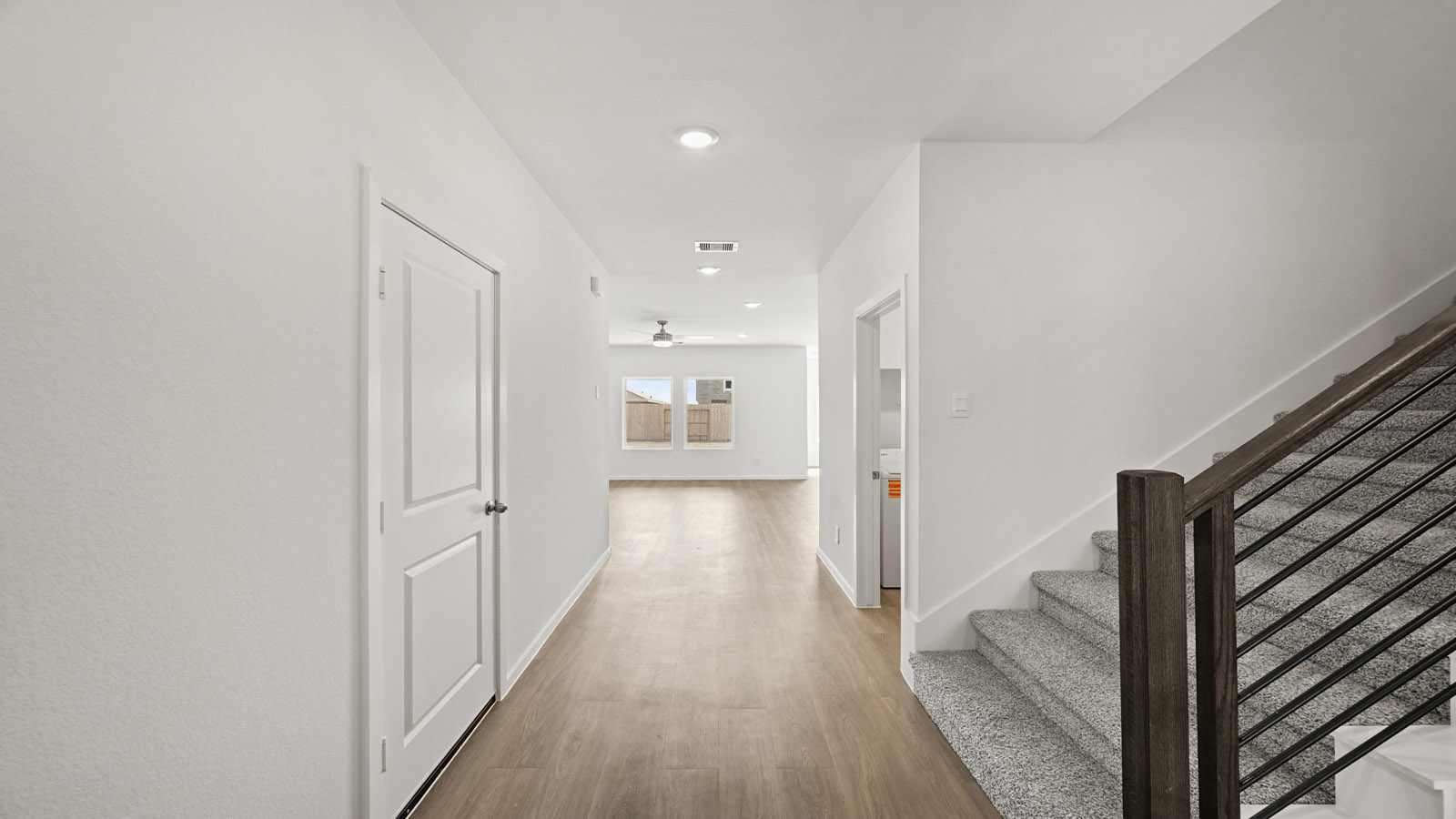 entryway with vinyl flooring and metal stair parts