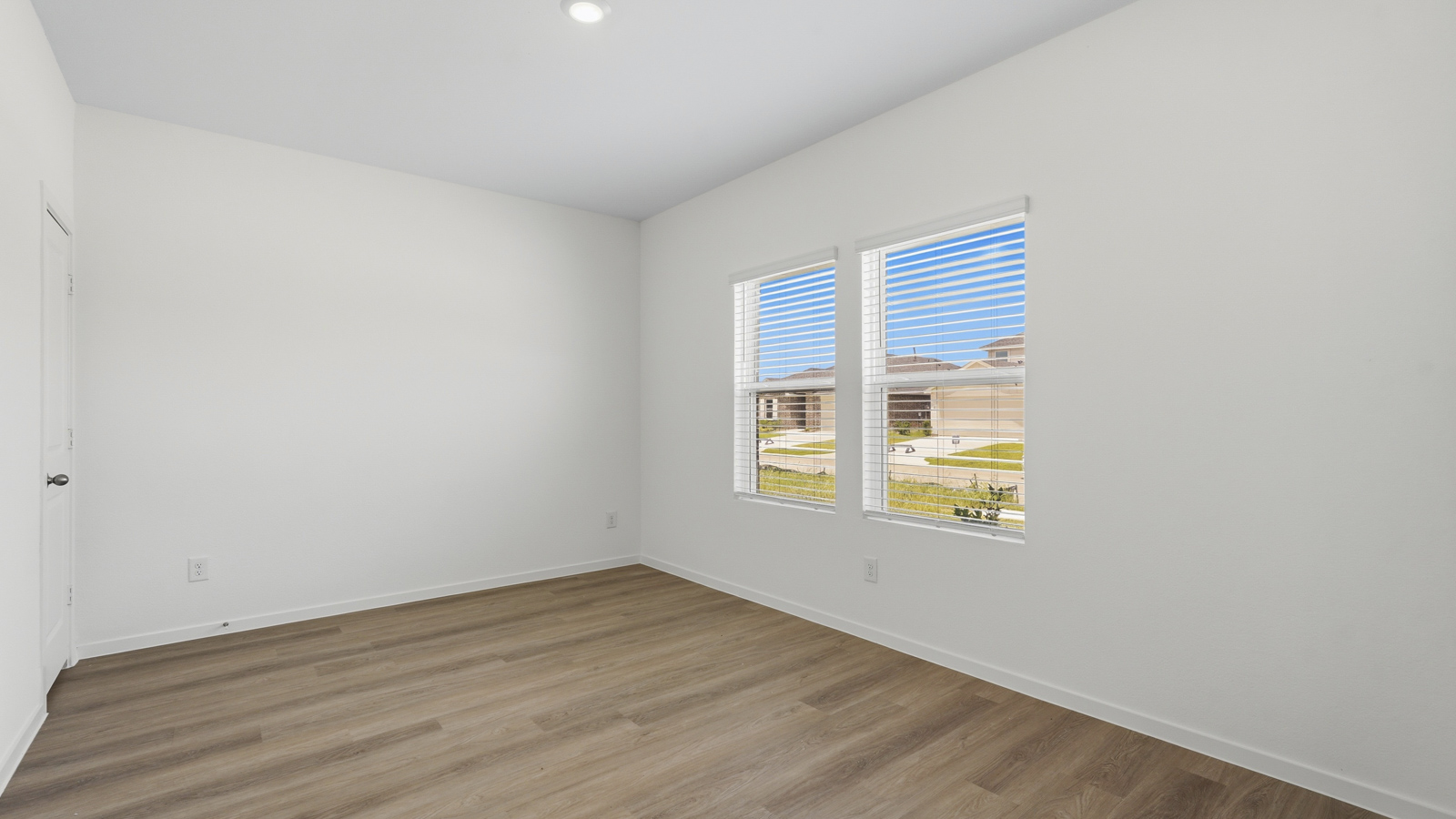 office with vinyl flooring and large window