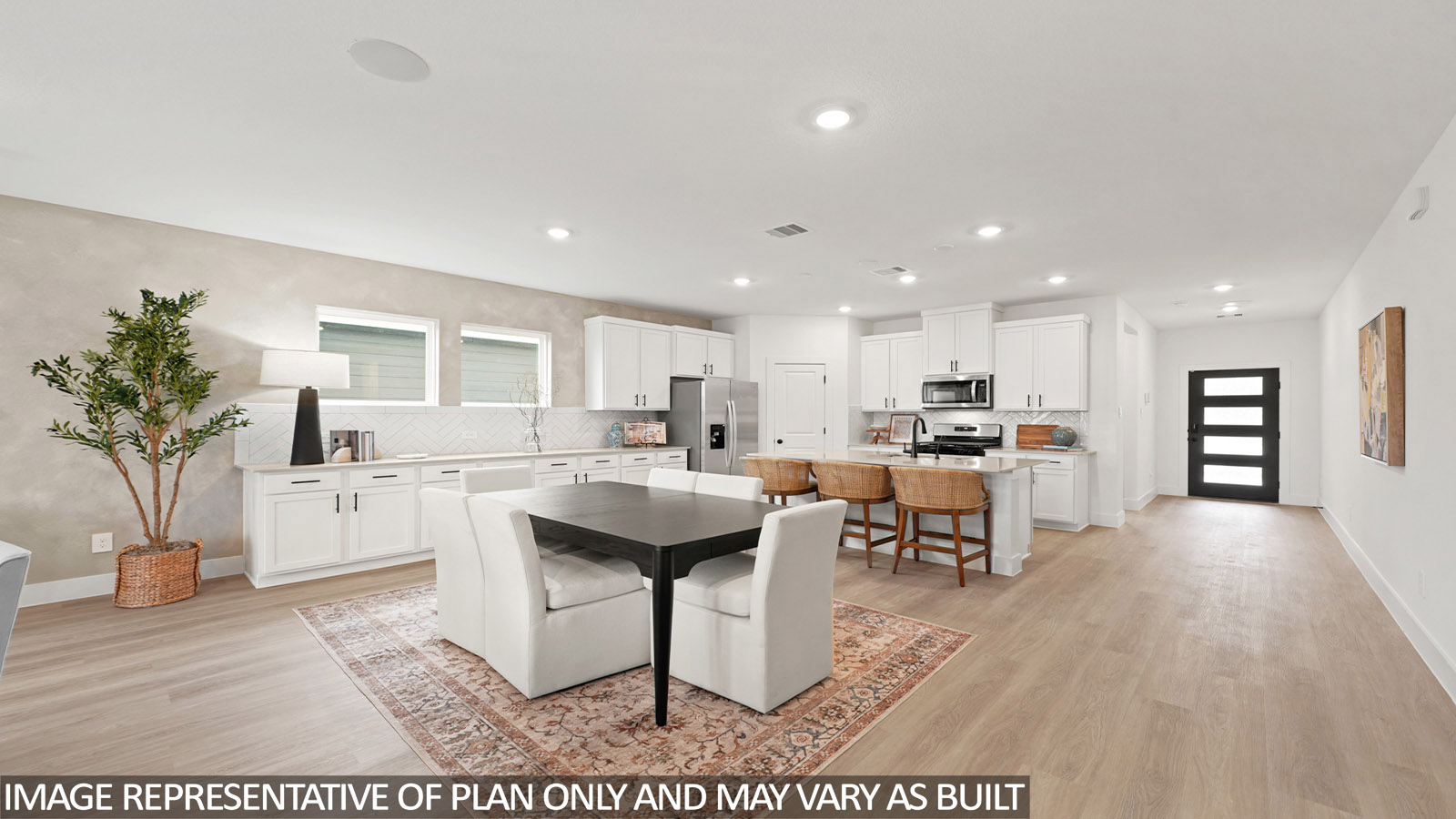open concept living and dining area with vinyl flooring, quartz countertops, and large windows