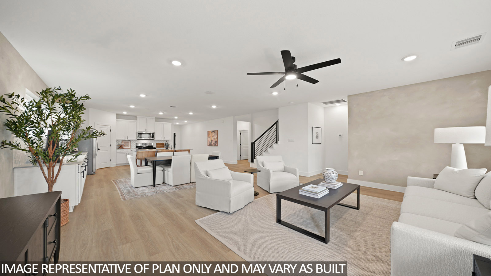 open concept living and dining area with vinyl flooring, quartz countertops, and large windows