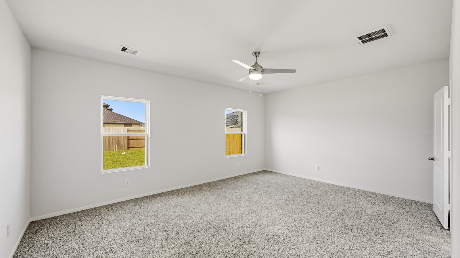Primary bedroom with carpet flooring and window in Hockley, TX