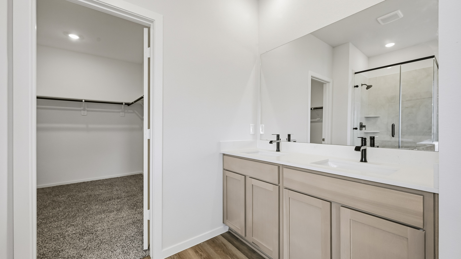 primary bathroom with separate tub and shower